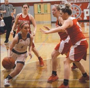 Three Toronto defenders were no match for River’s Riley Lollathin during the Lady Pilot’s 60-20 victory in the Division IV sectional final Saturday, Feb. 23 at River High School.