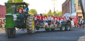 A tractor pulls a full float of members of the Woodsfield High School Class of 1964 Friday, June 14 during the annual Alumni Parade.