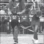 A pair of percussionists head onto the field during River’s halftime show Friday, Aug. 30.