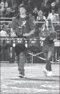 A pair of percussionists head onto the field during River’s halftime show Friday, Aug. 30.